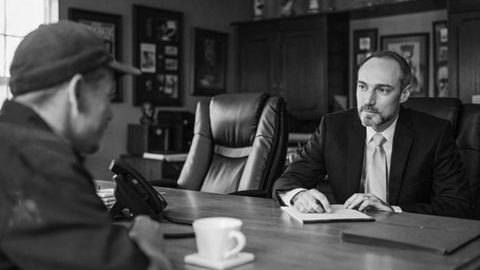 Personal Injury Ben Nelson speaks with a client about their personal injury claim