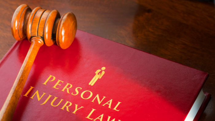 a-gavel-on-top-of-a-personal-injury-law-book A gavel is seen on top of a personal injury lawyer book
