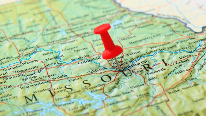 Map of missouri with red pin A map of missouri with a red pin in the middle of it. Columbia, Missouri is on this map.